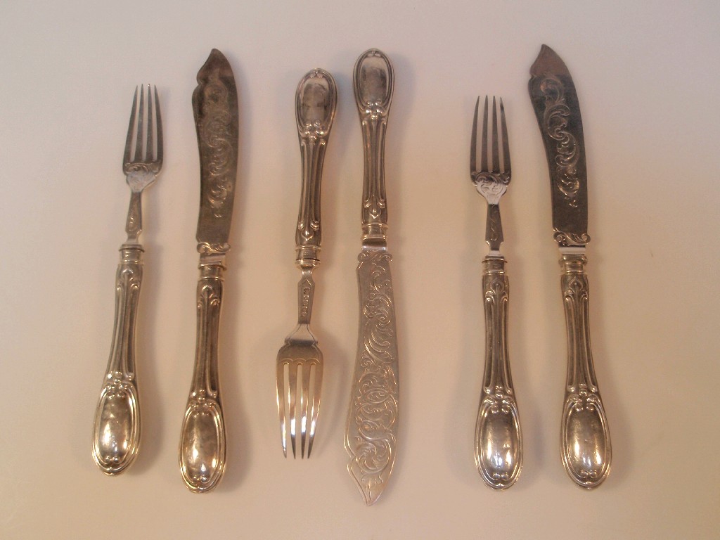 Appraisal: Three silver fish knives and forks Art Nouveau style handles