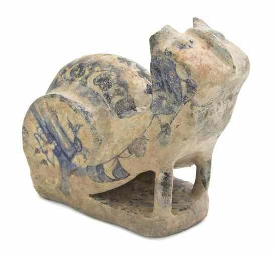 Appraisal: A Middle Eastern Pottery Animalier Figure depicting a seated stylized