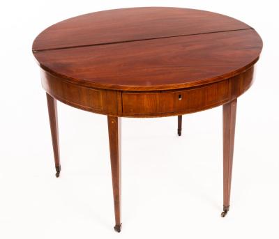 Appraisal: A Georgian mahogany D-shaped table with folding top fitted a