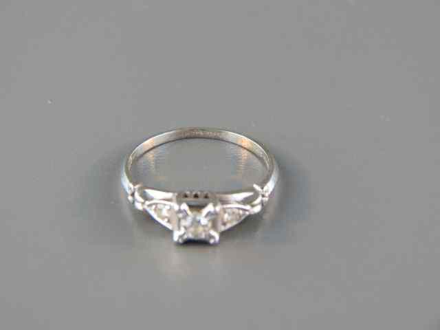 Appraisal: Diamond Ring carat round diamond with smaller diamond on each