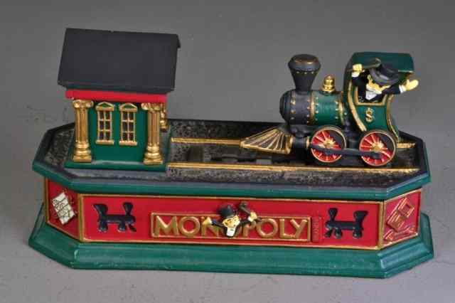 Appraisal: PAINTED METAL MONOPOLY TRAIN BANKMetal Monopoly train bank with Monopoly