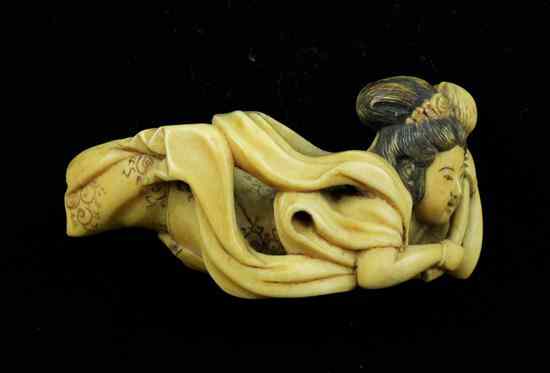 Appraisal: A Meiji period ivory netsuke carved as a tennin flying