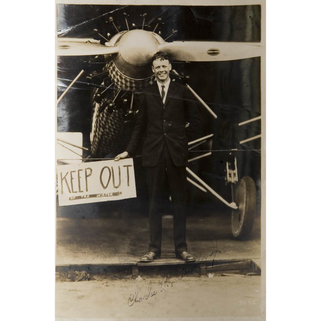 Appraisal: LINDBERGH CHARLES A Signed photograph depicting Lindbergh standing before the