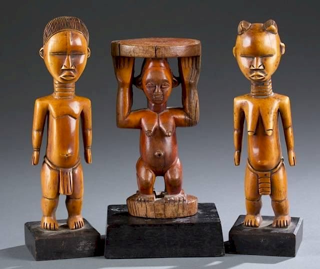 Appraisal: African carved ivory figures on wooden bases A group of