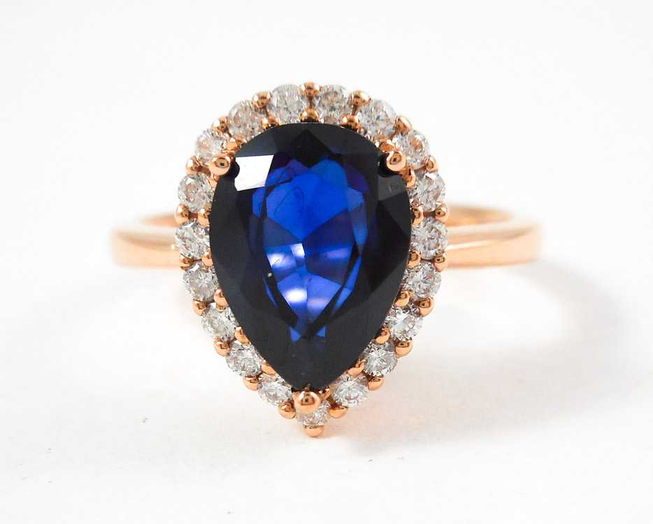 Appraisal: SAPPHIRE DIAMOND AND FOURTEEN KARAT GOLD RING The rose gold