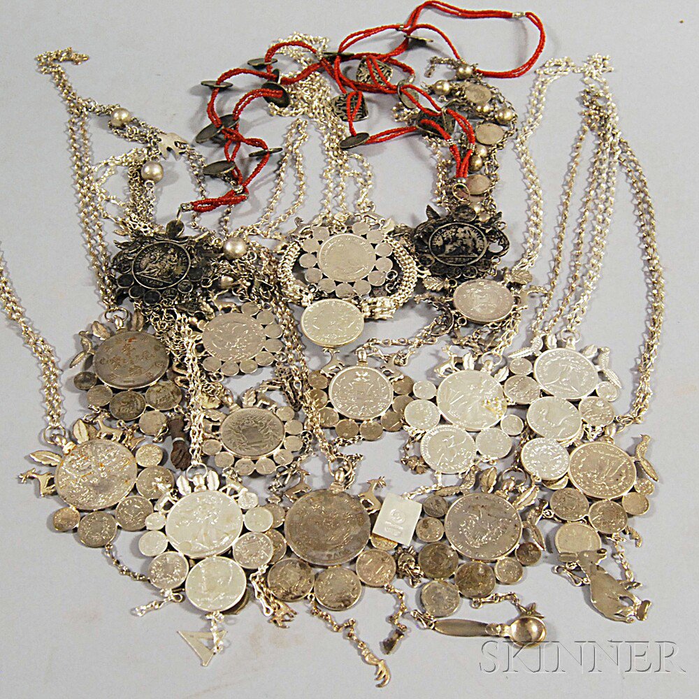 Appraisal: Sixteen Silver Coin Necklaces each pendant with large central world