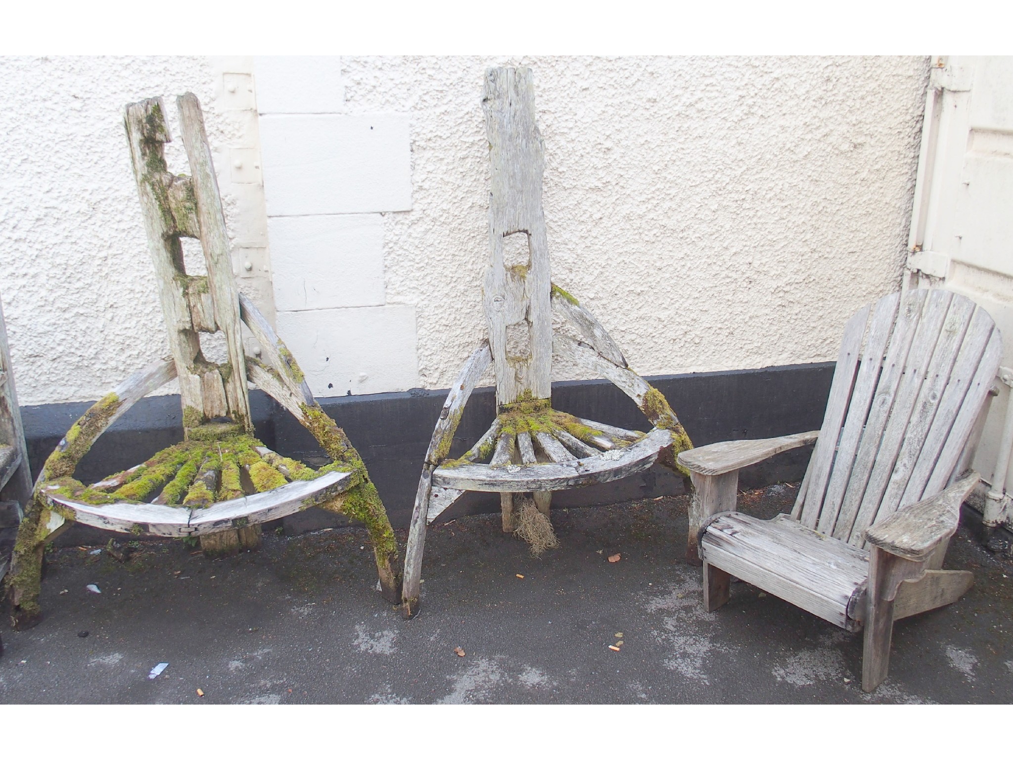 Appraisal: Two wooden garden seats made from cart wheels and another