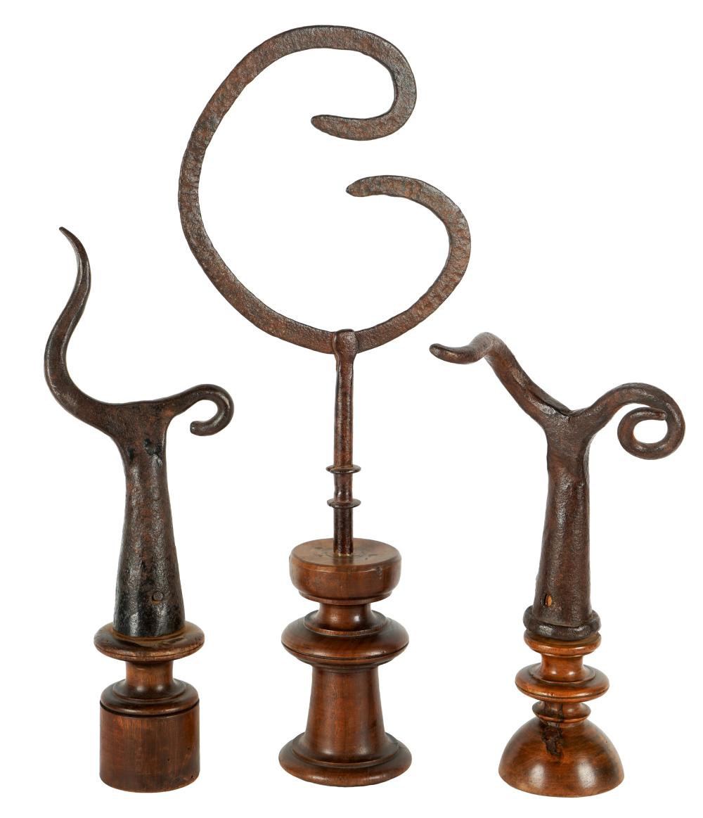 Appraisal: THREE IRON WOOD TABLE ORNAMENTSunsigned Provenance Property from a Hancock