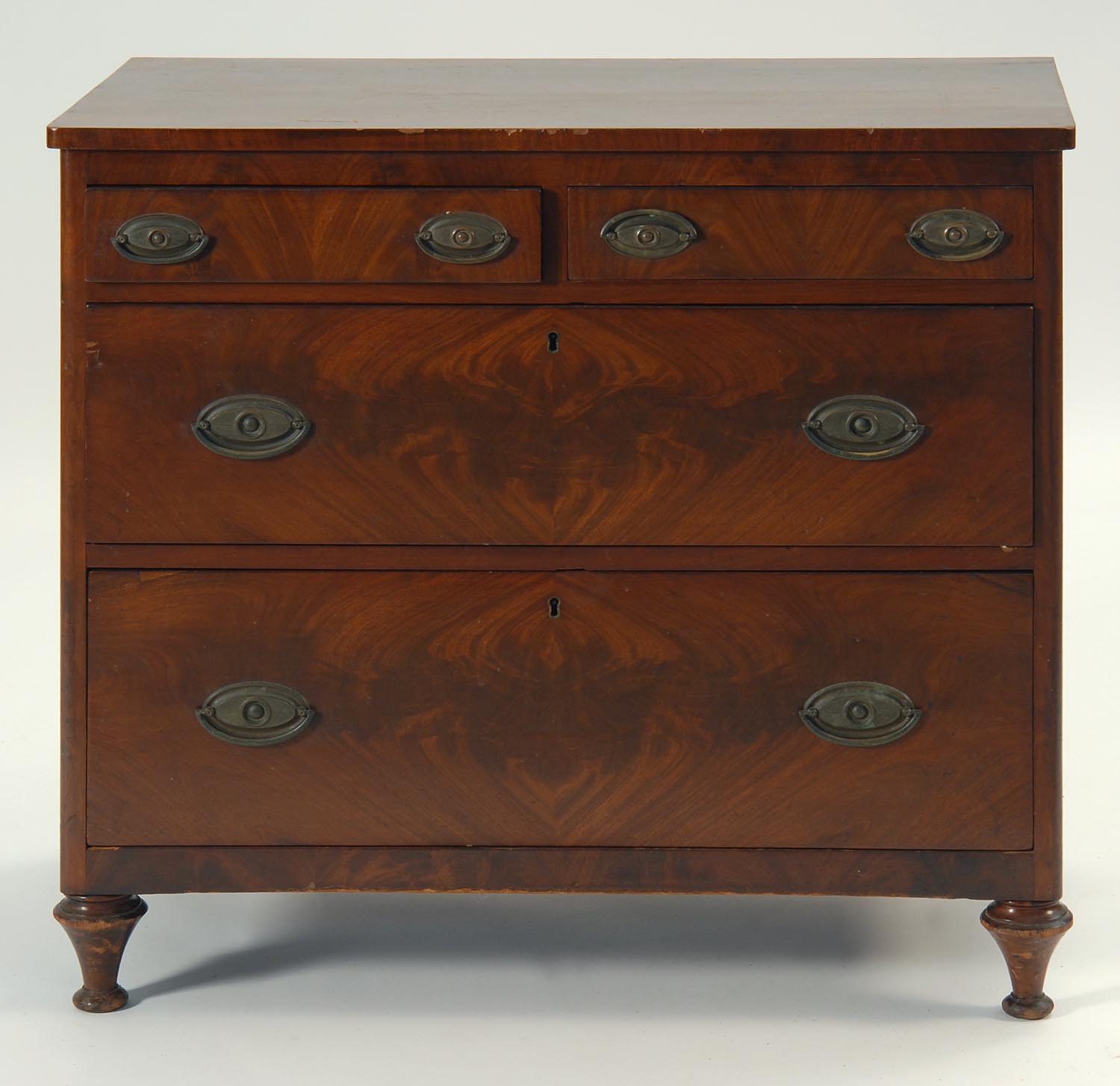 Appraisal: ANTIQUE AMERICAN FOUR-DRAWER CHEST in mahogany and mahogany veneer Turned