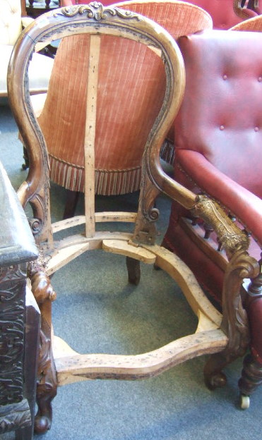 Appraisal: A Victorian mahogany open armchair frame the floral carved crest