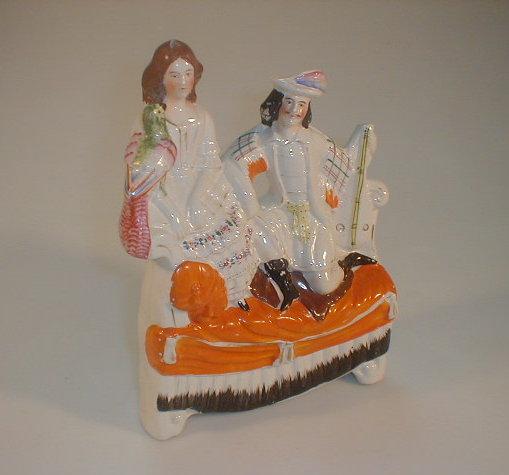 Appraisal: A thC Staffordshire Pottery flat back figure group modelled as