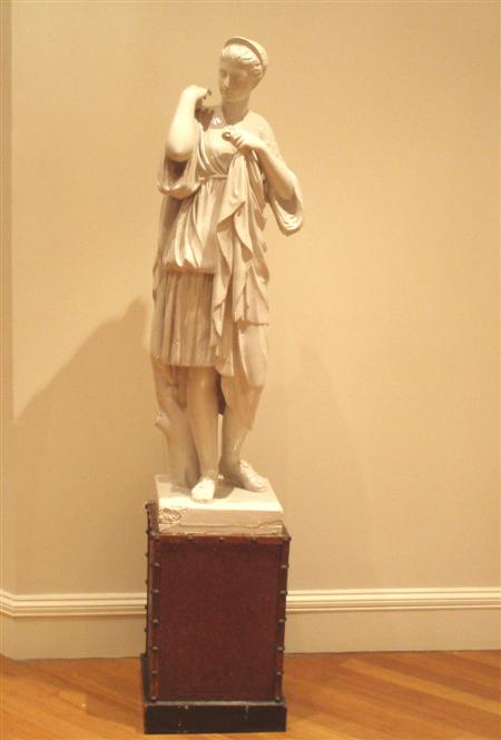 Appraisal: A large moulded plaster figure of a classical maiden standing