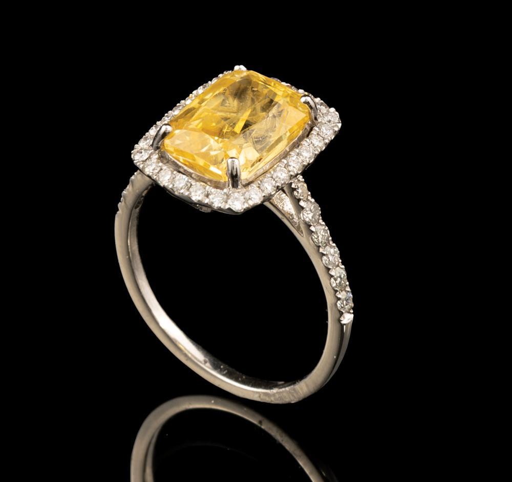 Appraisal: Platinum Yellow Sapphire and Diamond Ring central prong set modified