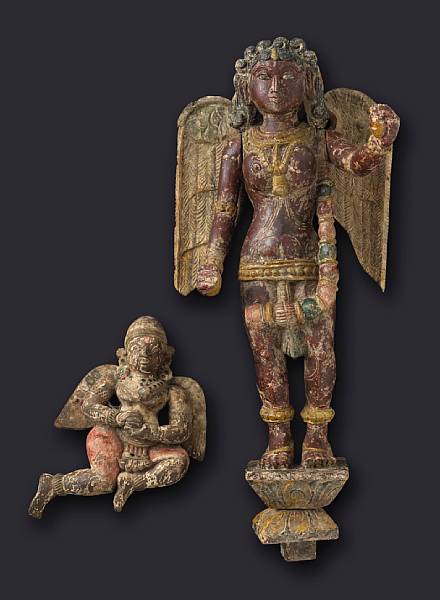 Appraisal: Two South Indian polychromed wood figures The first depicting a