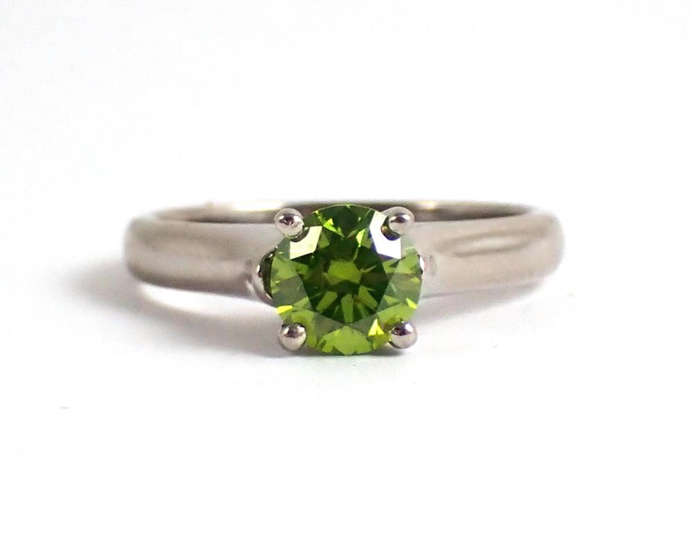 Appraisal: FANCY GREEN DIAMOND AND PLATINUM RING set with two small