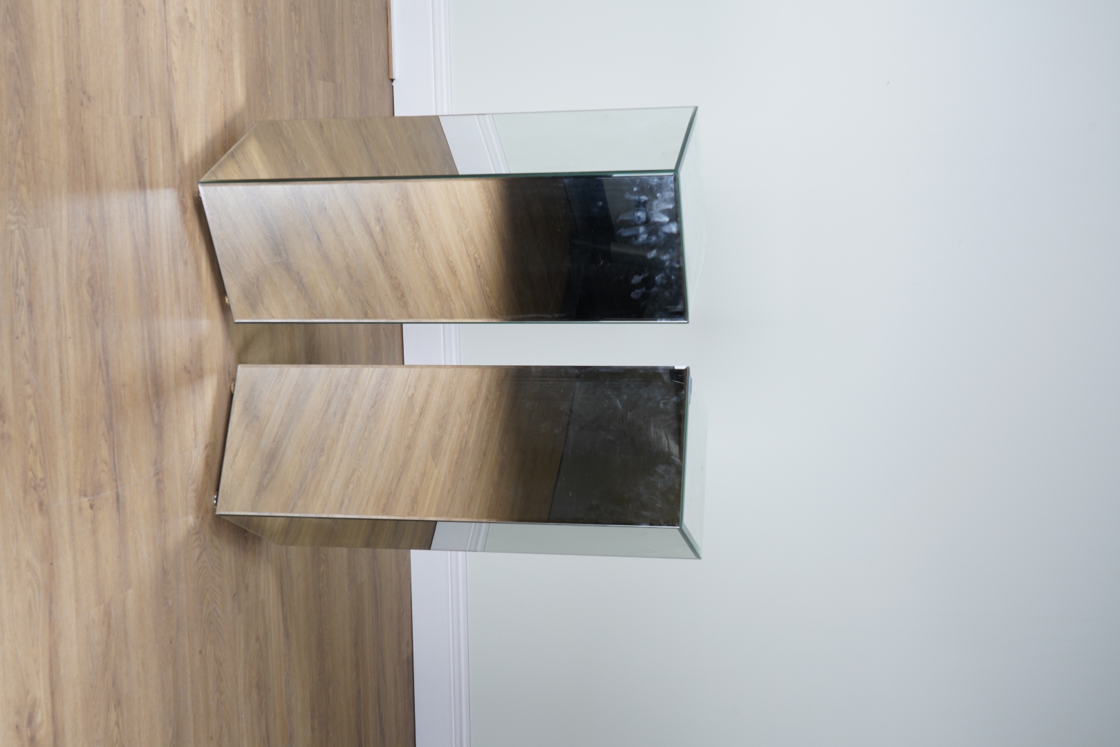 Appraisal: A PAIR OF MIRRORED GLASS SQUARE PEDESTALS cm wide x