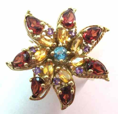 Appraisal: GARNET AMETHYST CITRINE AND GARNET RING seven pear-cut garnets seven