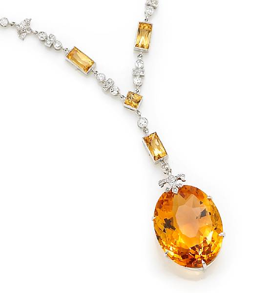 Appraisal: A citrine and diamond pendant necklace mounted in eighteen karat