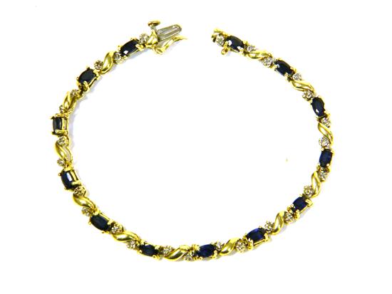 Appraisal: JEWELRY SAPPHIRE AND DIAMOND BRACELET K yellow gold contains thirteen