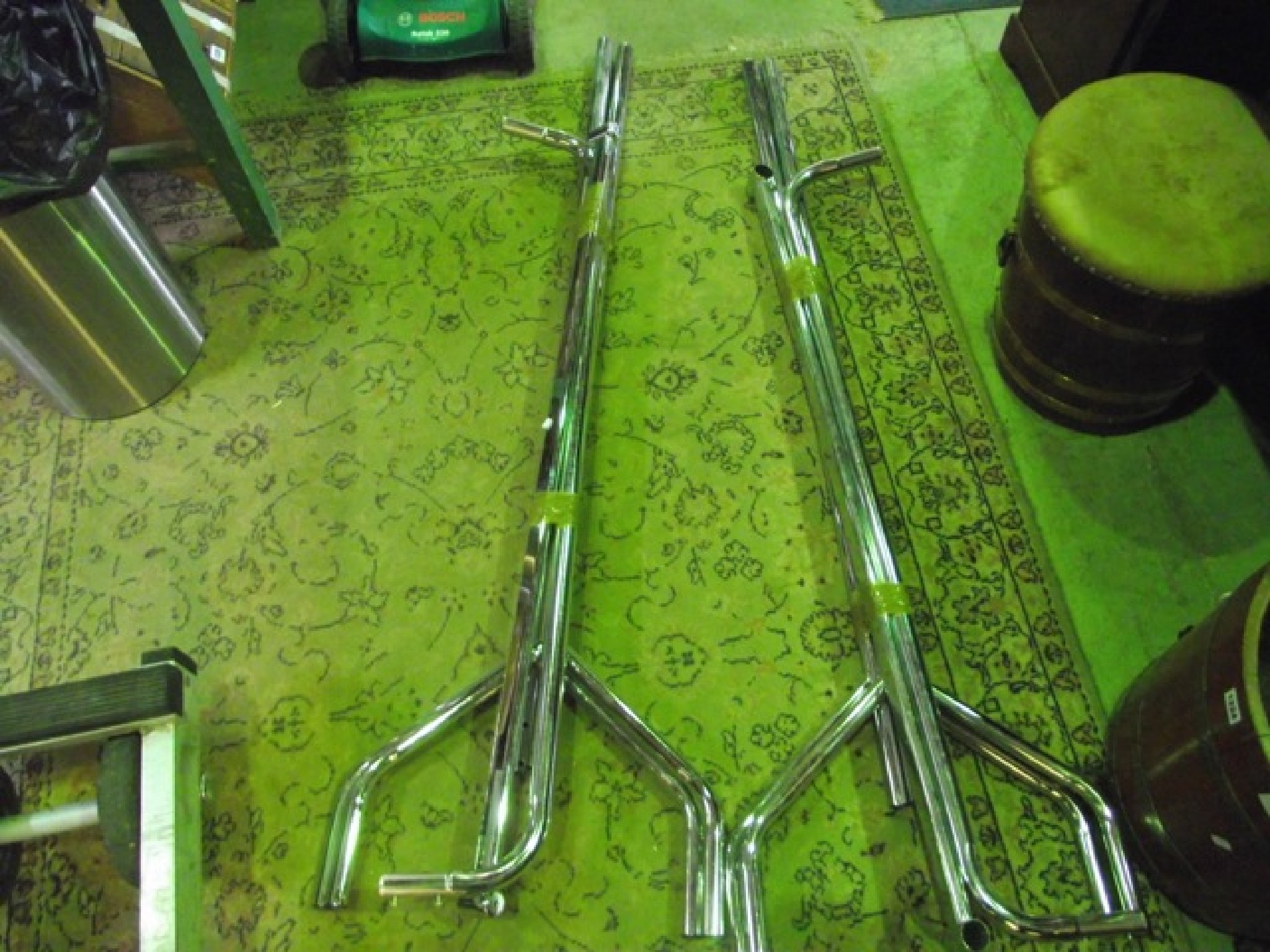 Appraisal: Two modern polished tubular steel framed floorstanding clothes rails