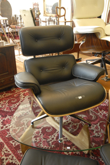 Appraisal: BLACK EAMES STYLE LOUNGE CHAIR WITH MATCHING OTTOMAN