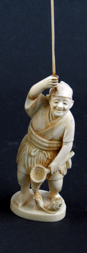 Appraisal: A JAPANESE IVORY OKIMONO CARVED FIGURE of a smiling fisherman