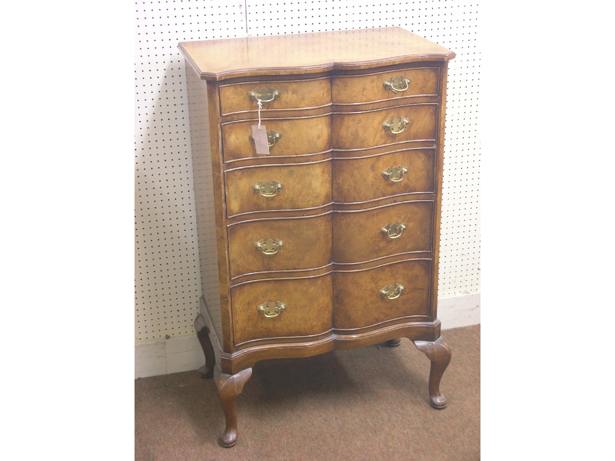 Appraisal: A walnut chest serpentine-fronted with five drawers brass hardware on