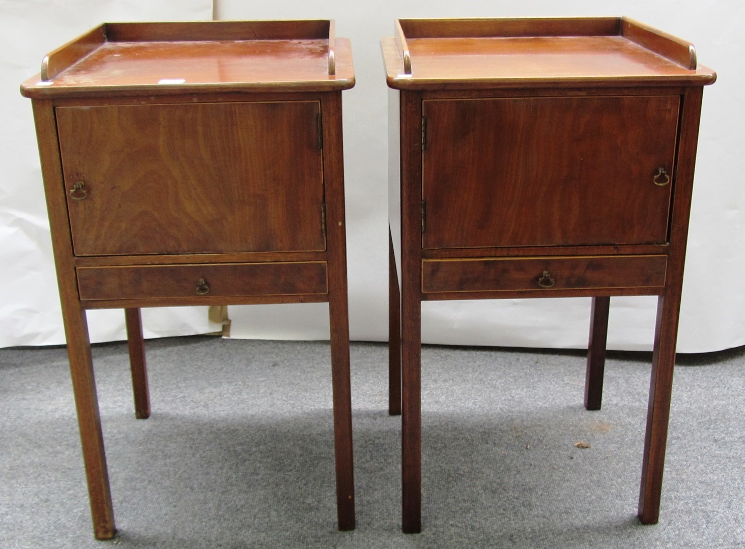 Appraisal: A pair of th style mahogany bedside tables each with