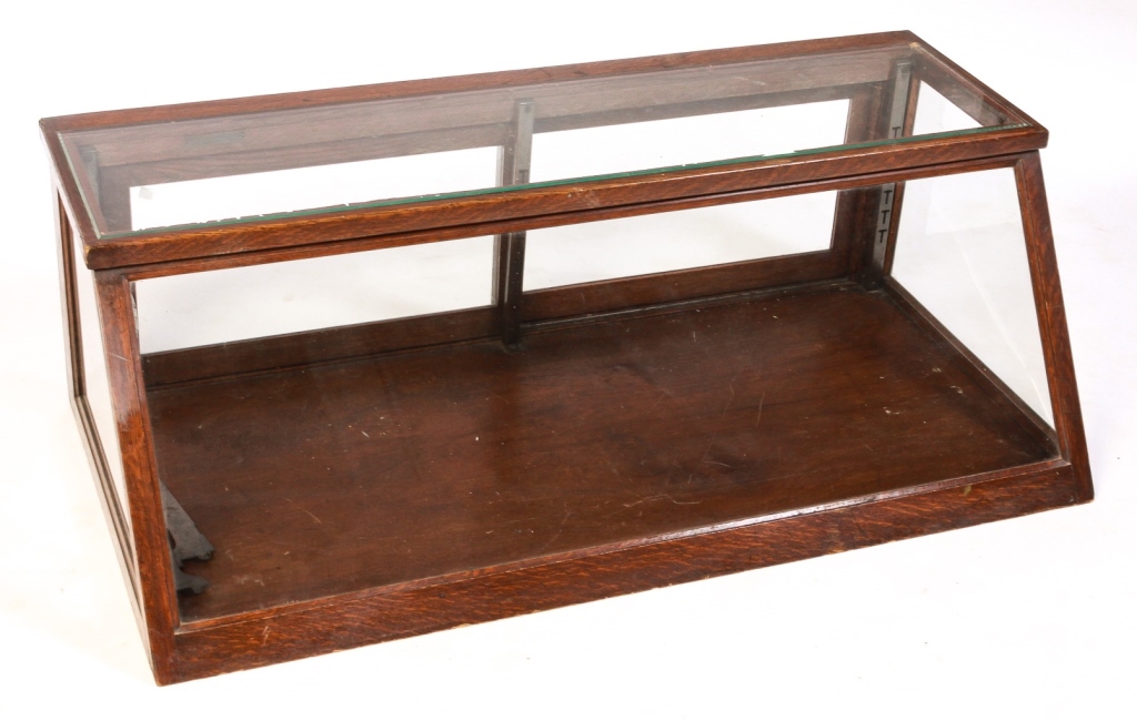 Appraisal: AMERICAN COUNTER TOP DISPLAY CASE Ca oak Beveled glass top