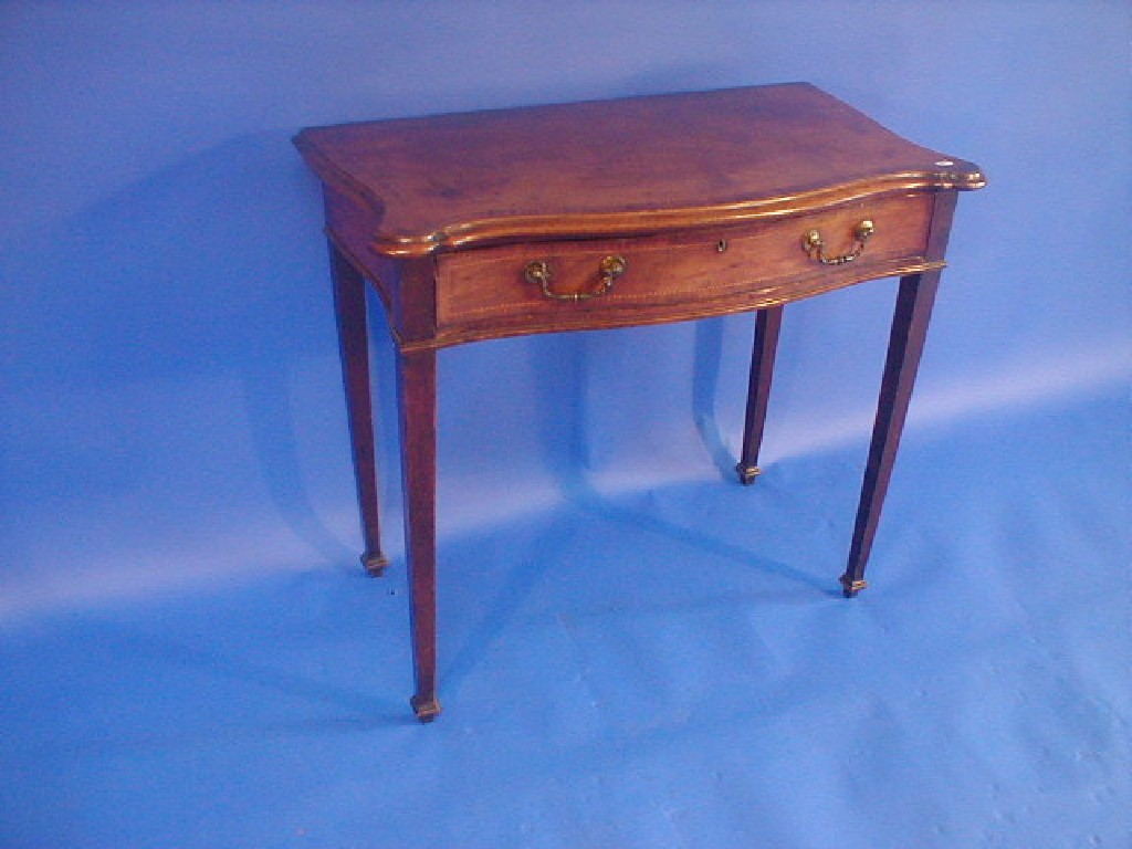 Appraisal: A George III mahogany serpentine fronted side table with cross