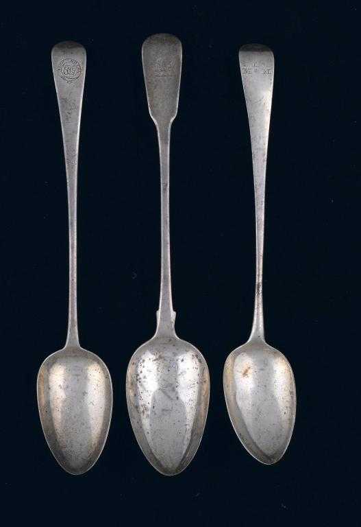 Appraisal: TWO GEORGE III GRAVY SPOONS AND A GEORGE IV GRAVY