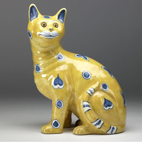 Appraisal: EMILE GALLE Faience cat with whimsical indigo motifs on yellow