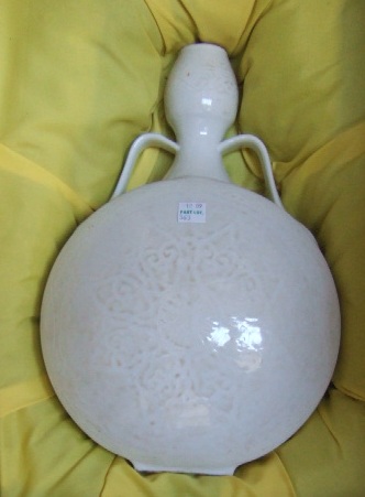 Appraisal: A pair of white-glazed monochrome moon flasks of globular form