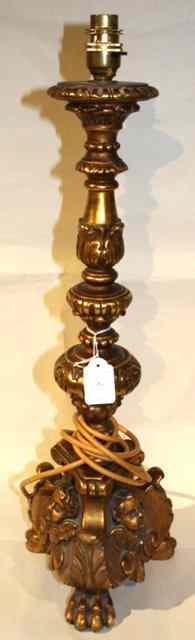 Appraisal: AN ITALIAN GILTWOOD AND GESSO ALTAR CANDLESTICK the triangular base