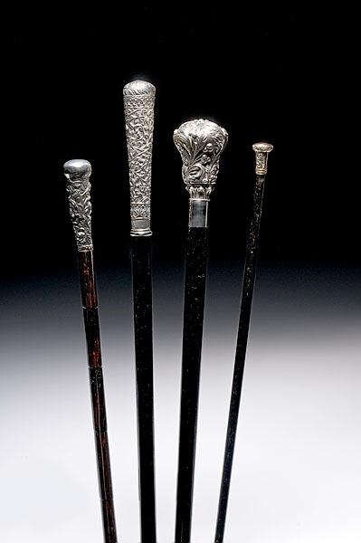 Appraisal: THREE SILVER-KNOBBED CANES AND A WALKING STICK all late th-