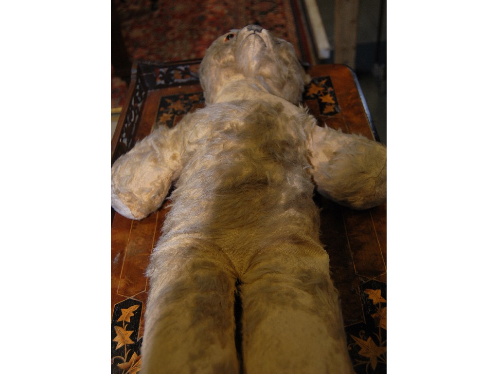 Appraisal: A worn plush teddy-bear cm to w a plaster figure