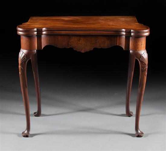 Appraisal: George II mahogany flip-top games table circa carved turret corners