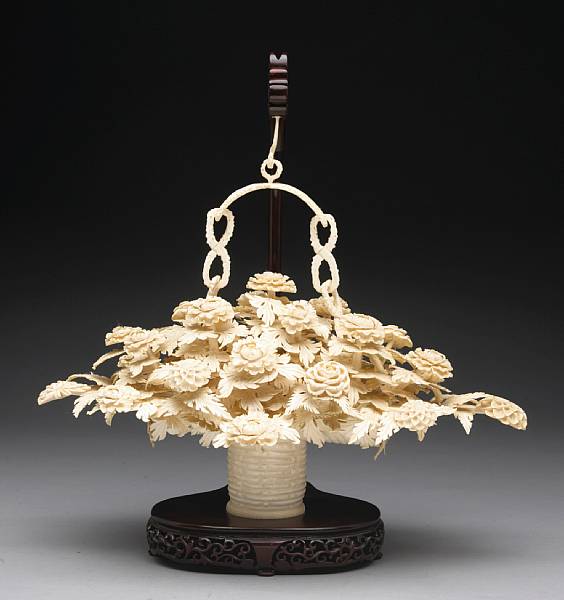 Appraisal: A large pieced ivory flower basket The ovoid basket carved