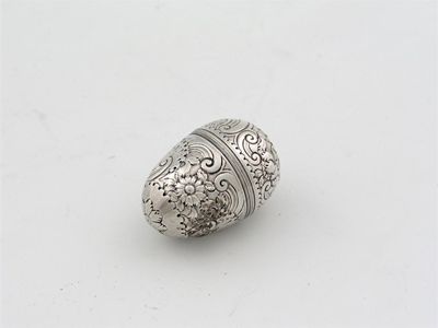 Appraisal: A George III ovular nutmeg grater foliate and scroll embossed