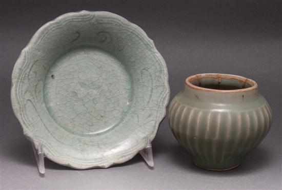 Appraisal: Chinese celadon glaze stoneware footed dish and a similar ribbed