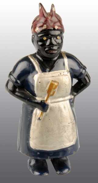 Appraisal: Cast Iron Aunt Jemima Mammy with Spoon Still Bank Description