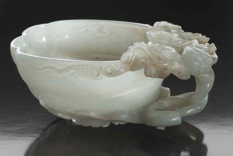 Appraisal: Chinese late Ming - Early Qing carved jadelibation cup depicting