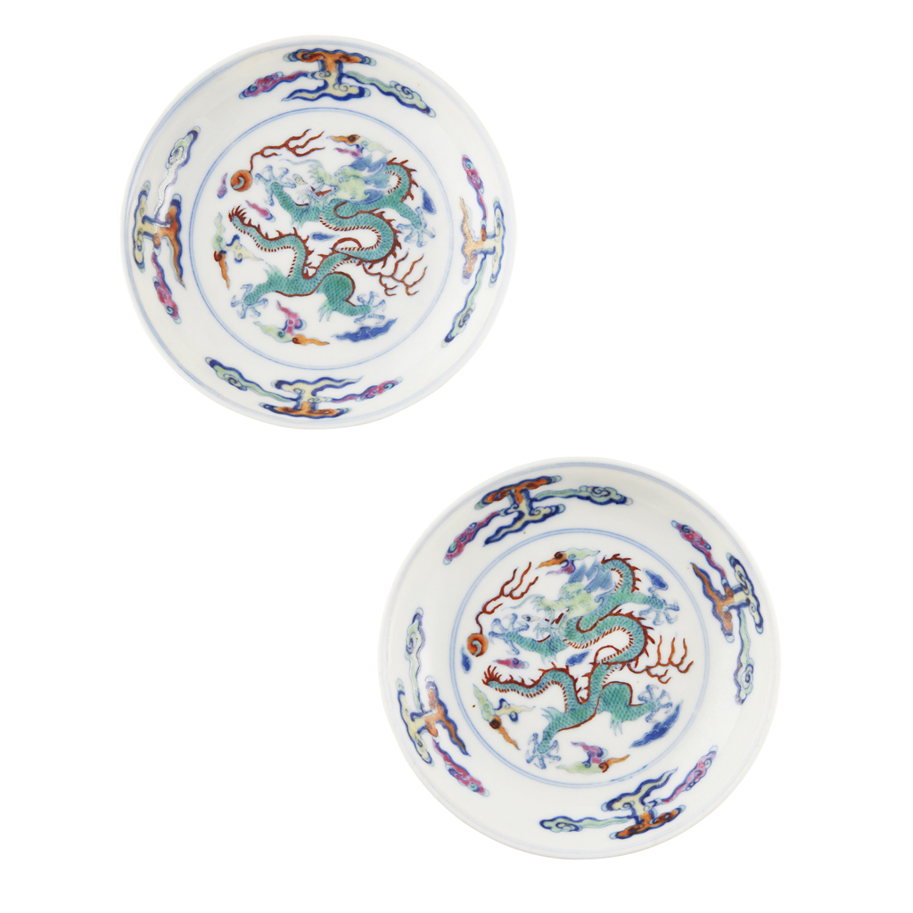 Appraisal: PAIR OF DOUCAI 'DRAGON' SAUCERS decorated with underglaze blue outlines