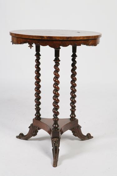 Appraisal: A VICTORIAN WALNUT OCCASIONAL TABLE the circular top with burr