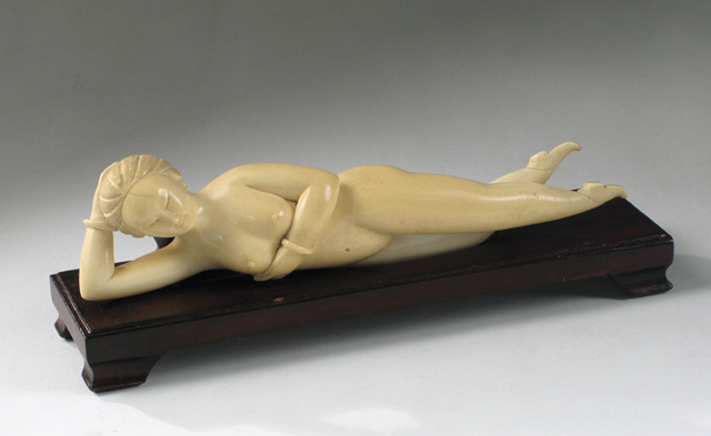 Appraisal: AN ASIAN IVORY RECLINING NUDE FEMALE FIGURE hand carved a