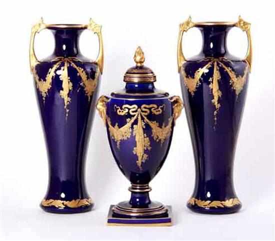 Appraisal: Continental porcelain garniture gilt cobalt-decorated covered urn and pair of