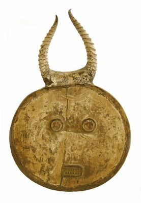 Appraisal: A Baule goli mask of circular form with relief eyes