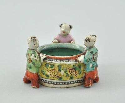 Appraisal: A Small Brush Wash Porcelain Figural Container Ching Of a