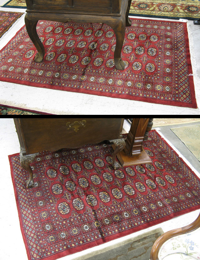 Appraisal: TWO PAKISTANI BOKHARA AREA RUGS both decorated with repeating columns