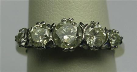 Appraisal: A platinum mounted five-stone diamond ring claw set with graduated